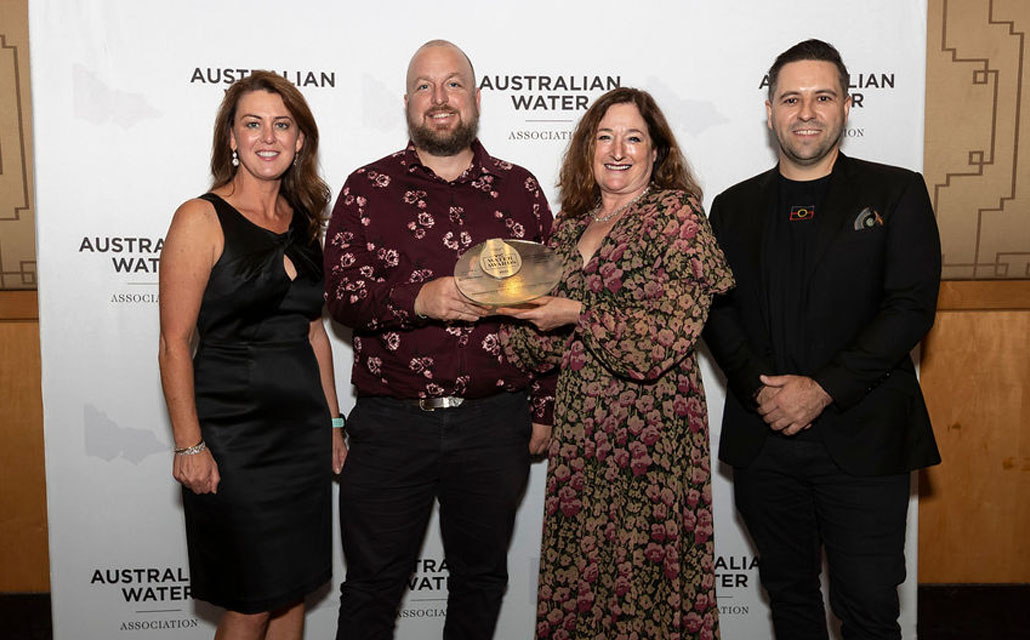 Barwon Water's Melissa Stephens, David McKinnis and Leoni Foley, with Wan Yaari Aboriginal Consultantancy Services' Ricky Kildea accept the award.